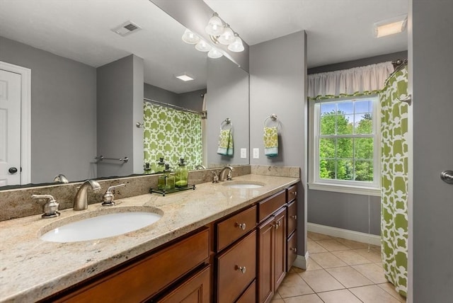 23 Crimson Dr, Shrewsbury, MA 01545 - bathroom with tile patterned floors, double vanity, and baseboards