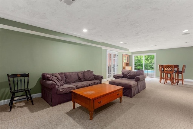 23 Crimson Dr, Shrewsbury, MA 01545 - living room with light colored carpet, baseboards, a textured ceiling, and recessed lighting