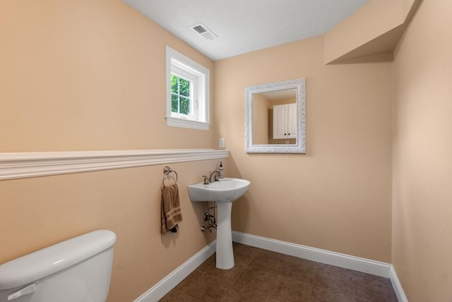 23 Crimson Dr, Shrewsbury, MA 01545 - bathroom with baseboards, toilet, and tile patterned flooring