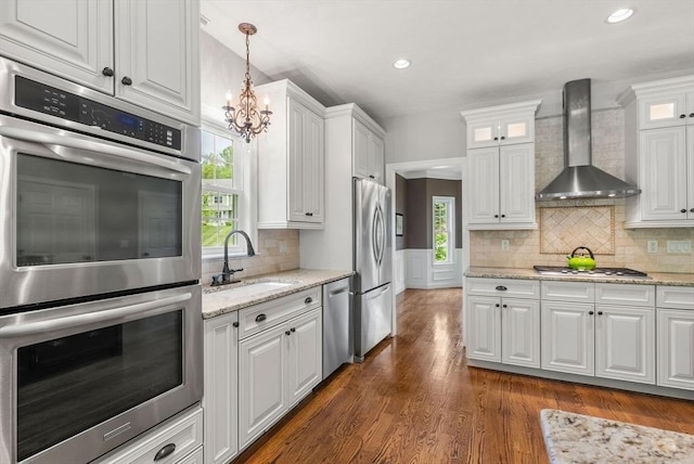 23 Crimson Dr, Shrewsbury, MA 01545 - kitchen featuring wall chimney exhaust hood, a sink, appliances with stainless steel finishes, white cabinetry, and recessed lighting