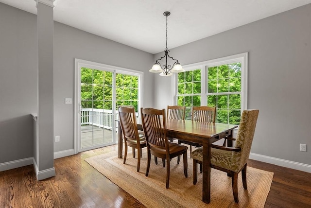 23 Crimson Dr, Shrewsbury, MA 01545 - dining space with baseboards, a chandelier, and wood finished floors
