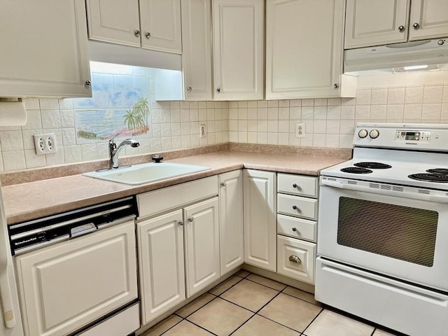 kitchen with white appliances, under cabinet range hood, a sink, light tile patterned flooring, and light countertops