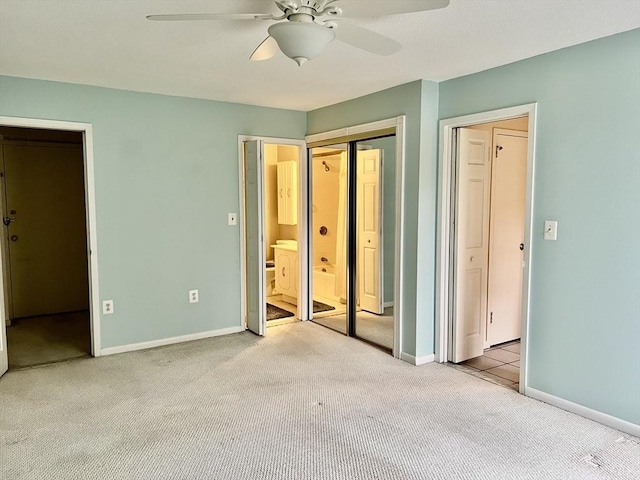unfurnished bedroom featuring carpet, baseboards, and ceiling fan