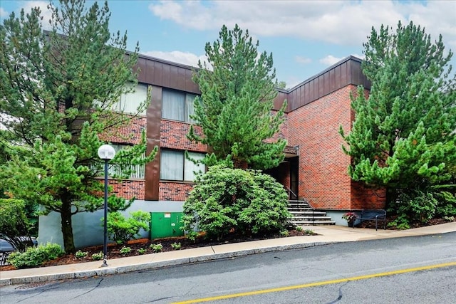 view of property featuring stairs