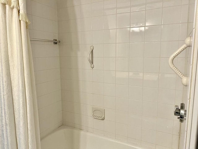 bathroom with shower / bath combination with curtain