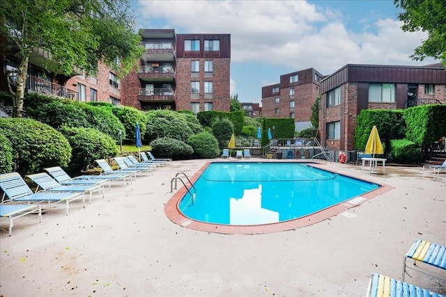 community pool featuring a patio