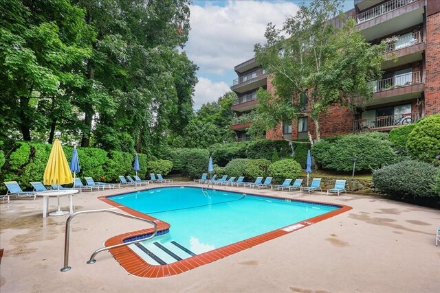 community pool with a patio