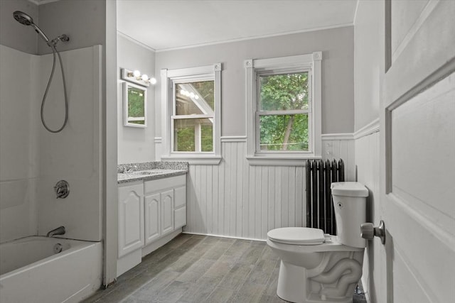 8 Hobson Ave, Worcester, MA 01603 - full bathroom featuring radiator heating unit, vanity, a wainscoted wall, wood finished floors, and  shower combination