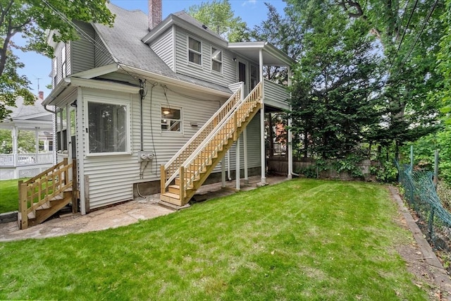 8 Hobson Ave, Worcester, MA 01603 - rear view of property with stairway, a fenced backyard, a chimney, and roof with shingles
