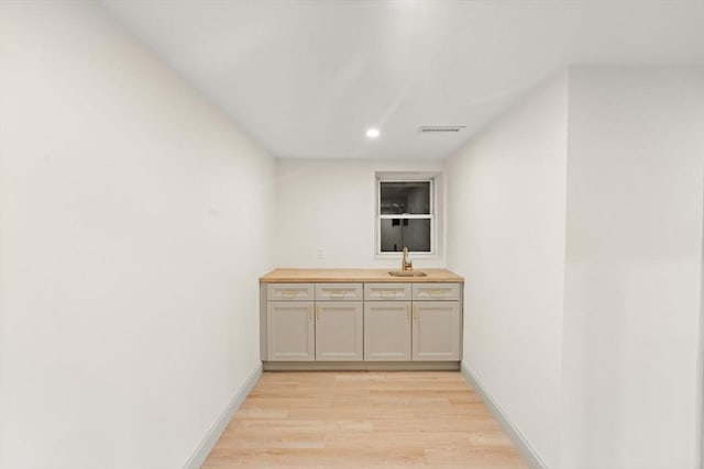 interior space with sink and light hardwood / wood-style floors