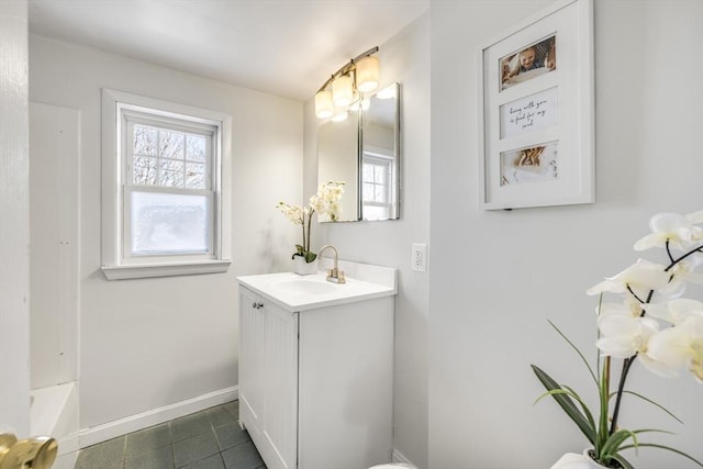 bathroom with tile patterned flooring and vanity