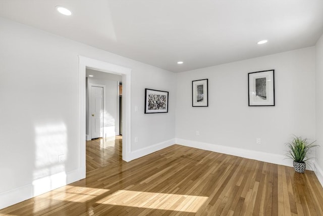 spare room featuring hardwood / wood-style floors