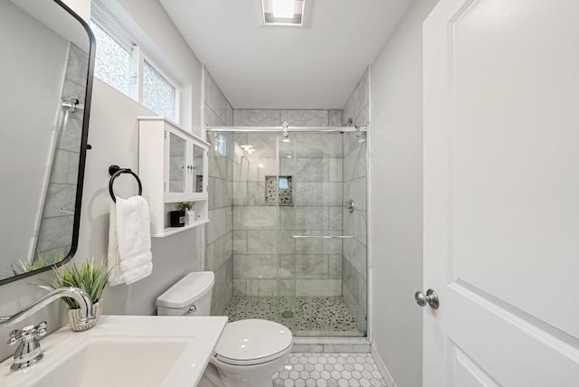225 Amory St, Boston, MA 02130 - bathroom featuring a sink, toilet, a shower stall, and tile patterned flooring