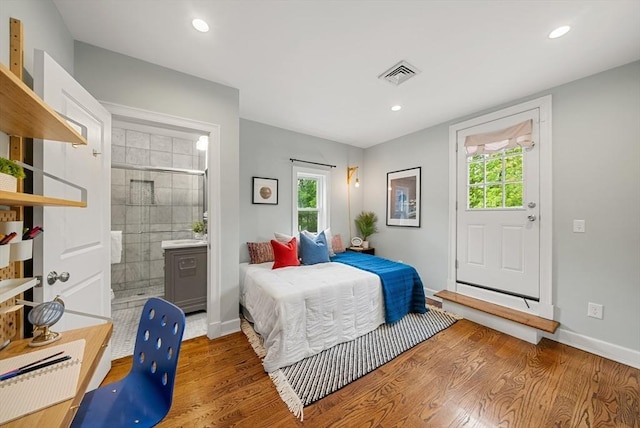 225 Amory St, Boston, MA 02130 - bedroom featuring wood finished floors, baseboards, recessed lighting, and ensuite bath