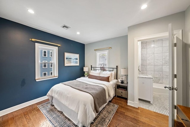 225 Amory St, Boston, MA 02130 - bedroom with wood finished floors, recessed lighting, baseboards, and ensuite bathroom