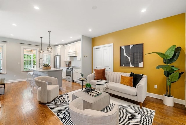 225 Amory St, Boston, MA 02130 - living area with light wood-type flooring, baseboards, and recessed lighting