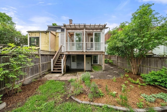 225 Amory St, Boston, MA 02130 - back of house featuring stairway, a fenced backyard, a pergola, and a deck