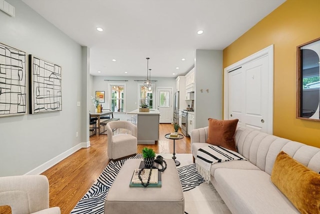 225 Amory St, Boston, MA 02130 - living area featuring light wood finished floors, recessed lighting, healthy amount of natural light, and baseboards