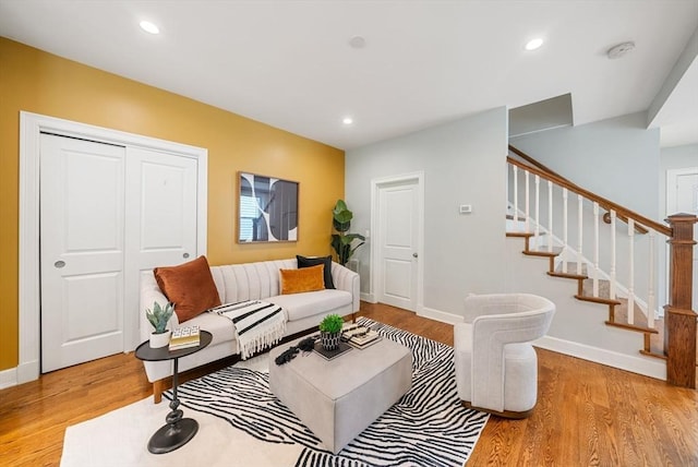 225 Amory St, Boston, MA 02130 - living room with stairs, wood finished floors, baseboards, and recessed lighting