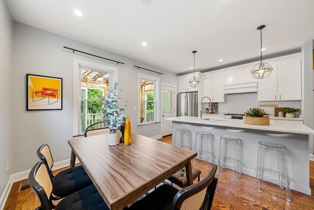 225 Amory St, Boston, MA 02130 - dining space with light wood finished floors, recessed lighting, and baseboards