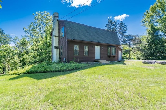 231 Audubon Rd, Northampton, MA 01053 - view of front of house featuring a chimney, a front yard, roof with shingles, and a gambrel roof