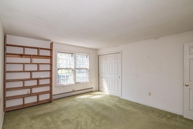 231 Audubon Rd, Northampton, MA 01053 - unfurnished bedroom featuring baseboard heating, carpet, a textured ceiling, and a closet