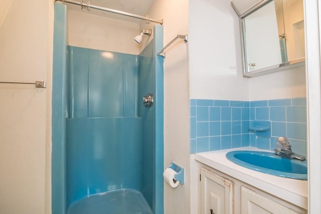 231 Audubon Rd, Northampton, MA 01053 - full bathroom with a shower, vanity, and tile walls