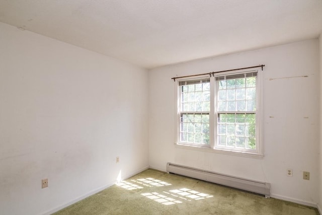 231 Audubon Rd, Northampton, MA 01053 - unfurnished room featuring a baseboard radiator, healthy amount of natural light, and carpet flooring