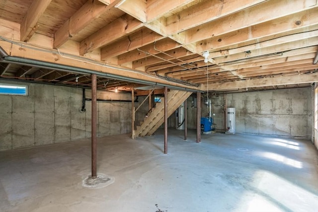 231 Audubon Rd, Northampton, MA 01053 - unfinished basement featuring water heater, stairway, and a heating unit