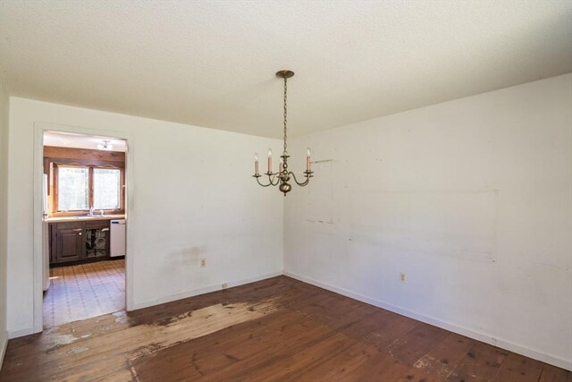 231 Audubon Rd, Northampton, MA 01053 - empty room with wood-type flooring, a chandelier, and baseboards