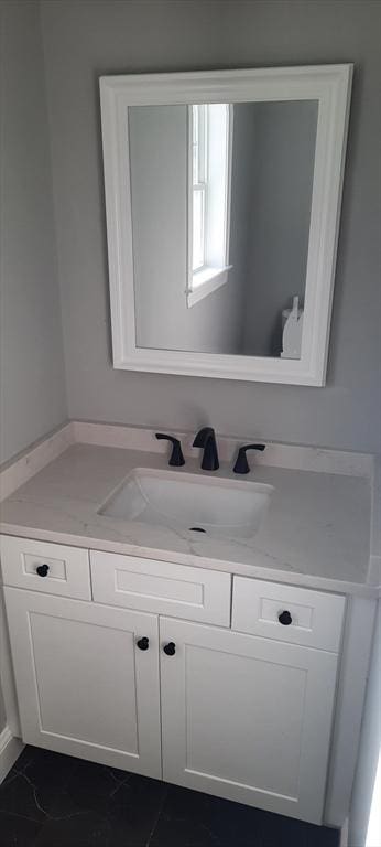 bathroom featuring tile patterned flooring and vanity