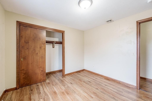 20 Cady St, Ludlow, MA 01056 - unfurnished bedroom with light wood finished floors and a closet