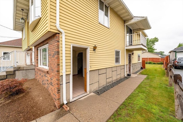 20 Cady St, Ludlow, MA 01056 - view of home's exterior featuring a balcony and brick siding