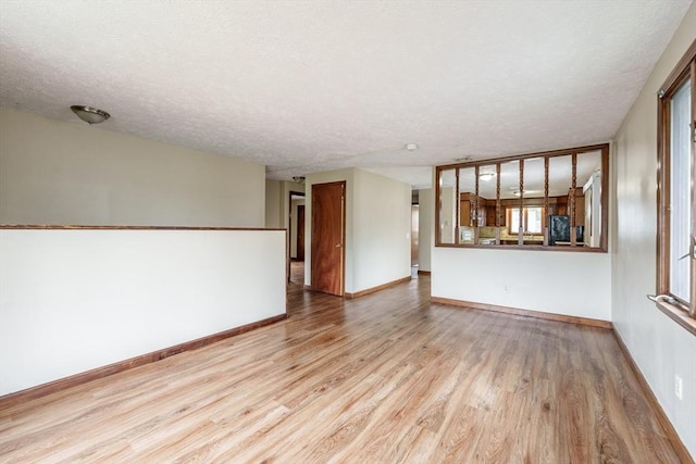20 Cady St, Ludlow, MA 01056 - unfurnished living room with wood finished floors and a textured ceiling