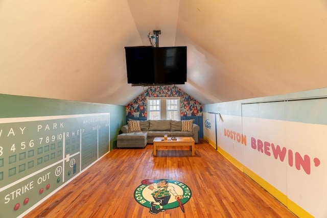 game room with vaulted ceiling and hardwood / wood-style floors