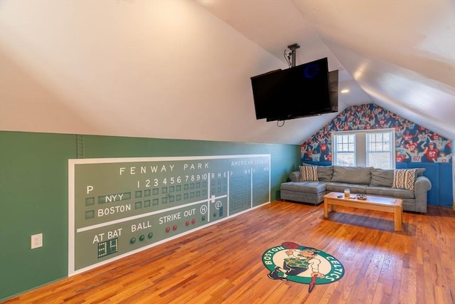 interior space featuring hardwood / wood-style flooring and lofted ceiling