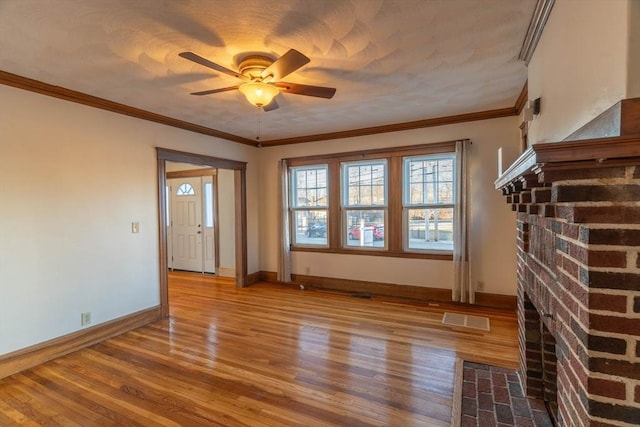 interior space featuring crown molding, ceiling fan, and hardwood / wood-style floors