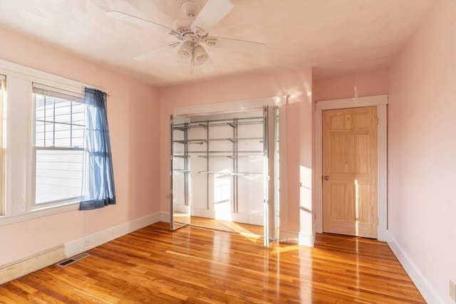 empty room featuring ceiling fan and wood-type flooring