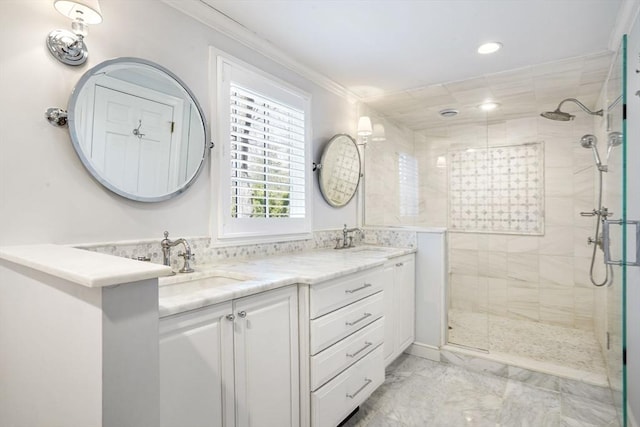 bathroom with crown molding, vanity, and an enclosed shower