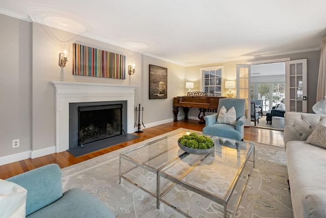 living room with crown molding and hardwood / wood-style flooring