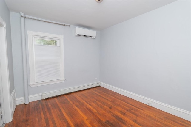 172 Doyle Ave Unit 1, Providence, RI 02906 - empty room with baseboards, a wall unit AC, wood finished floors, and a baseboard radiator