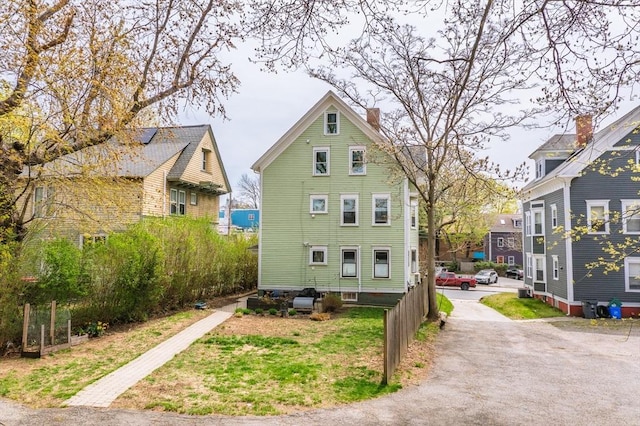 172 Doyle Ave Unit 1, Providence, RI 02906 - view of home's exterior featuring a chimney