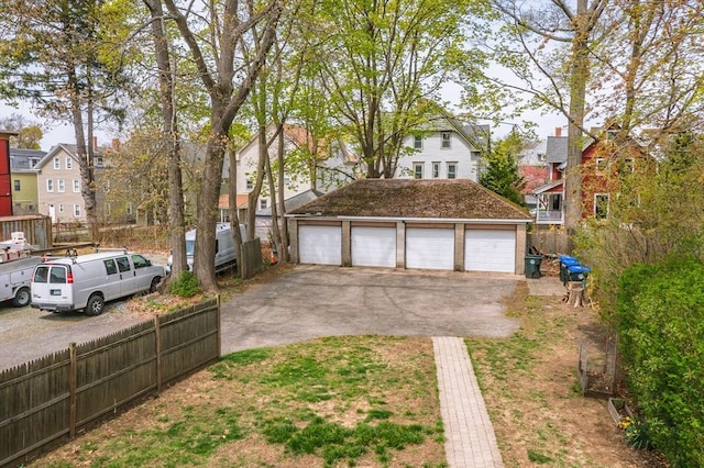 172 Doyle Ave Unit 1, Providence, RI 02906 - exterior space with an outdoor structure, a garage, fence, and a residential view