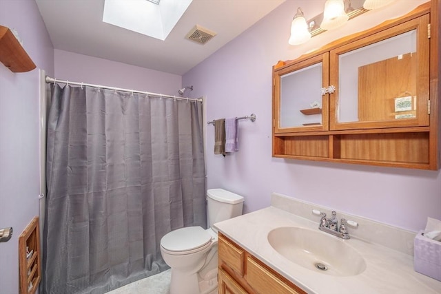 453 Homestead Ave, Holyoke, MA 01040 - bathroom featuring a skylight, toilet, vanity, and a shower with shower curtain
