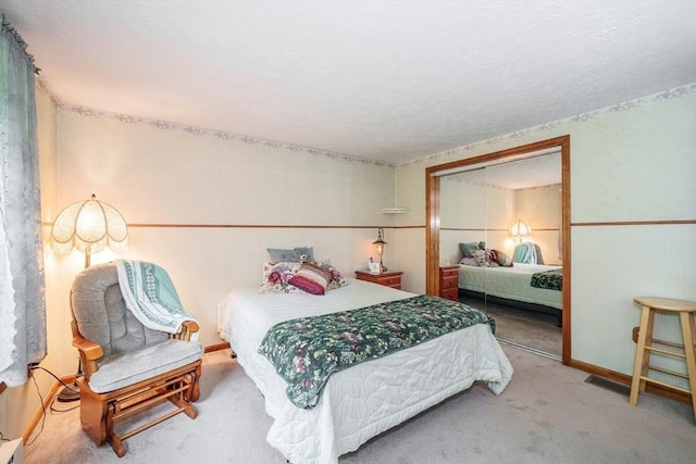453 Homestead Ave, Holyoke, MA 01040 - bedroom with carpet floors, a textured ceiling, and a closet