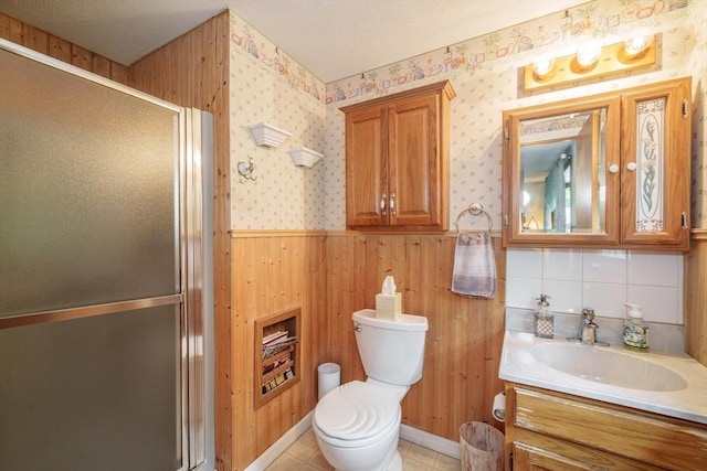 453 Homestead Ave, Holyoke, MA 01040 - bathroom with toilet, a stall shower, a wainscoted wall, vanity, and wallpapered walls