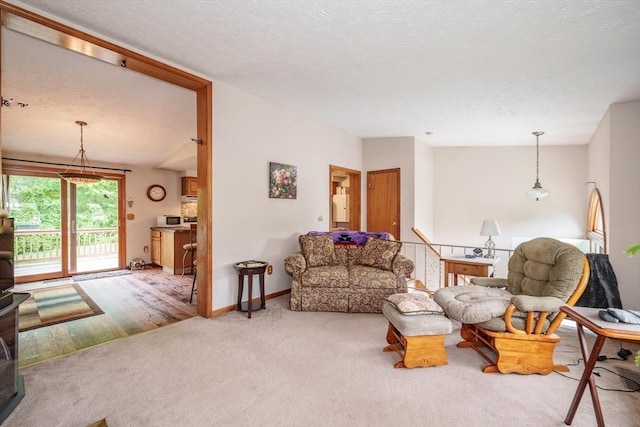453 Homestead Ave, Holyoke, MA 01040 - carpeted living room featuring a textured ceiling