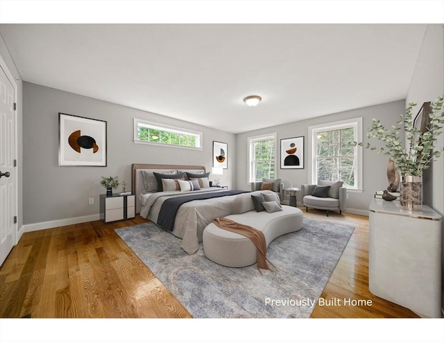 bedroom with hardwood / wood-style flooring