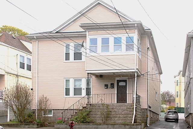 traditional home with covered porch and stairs