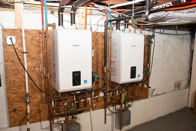 utility room featuring tankless water heater
